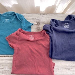 Carters onesies size 9 months.